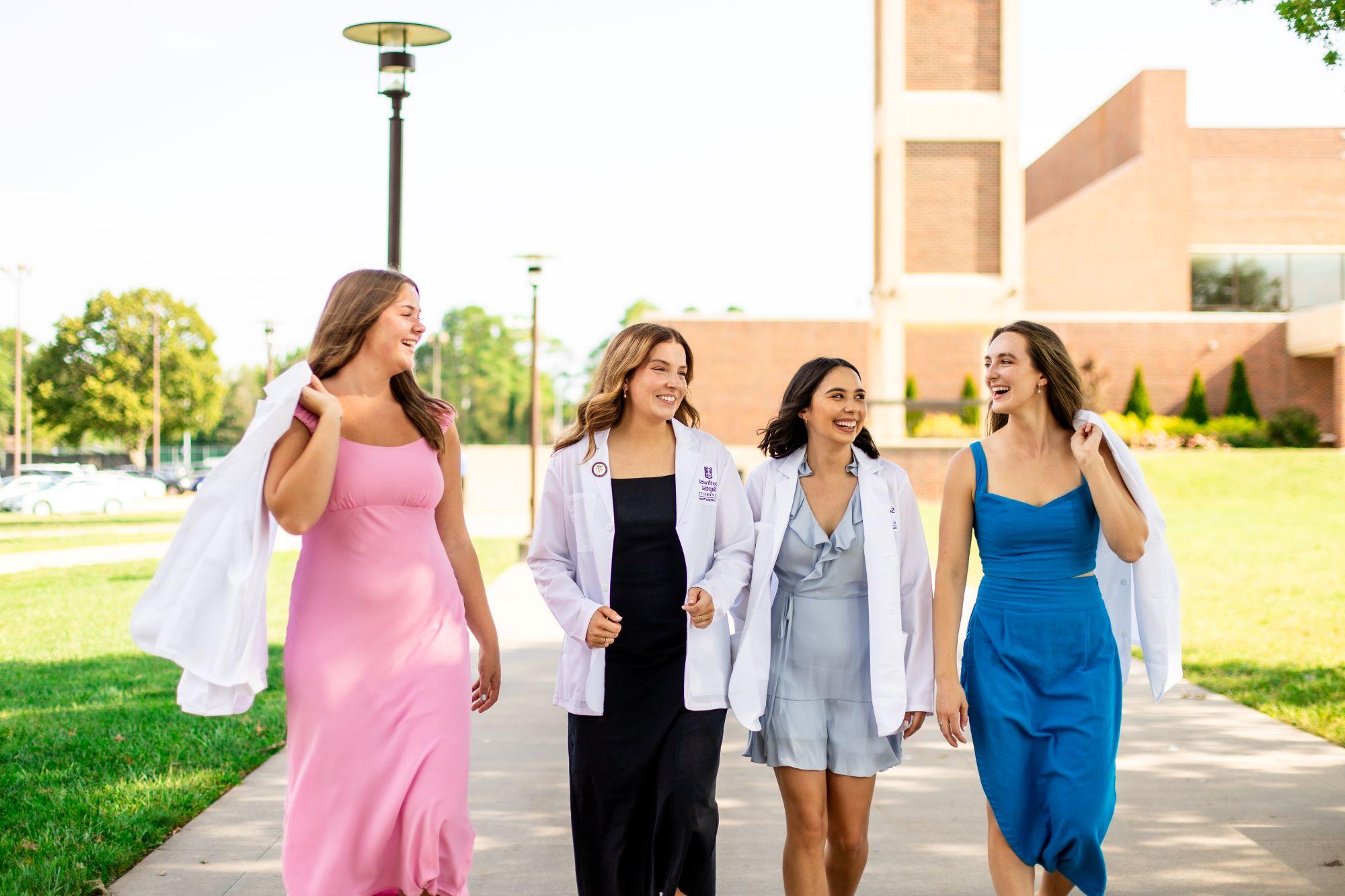 physical therapy students walk together on Bolivar campus